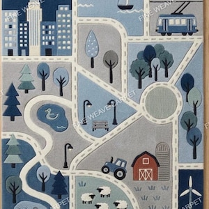 May include: A blue and gray children's rug with a city, road, and farm scene. The rug features buildings, trees, a pond with a duck, a tractor, sheep, and a windmill. The rug has a night sky with a moon and stars.