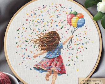 May include: Cross-stitch hoop art featuring a girl holding colorful balloons, with confetti-like stitches around her. The girl wears a blue top and a red skirt. The artwork is framed in a wooden hoop.