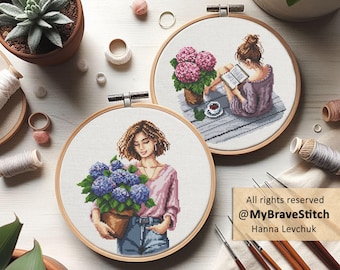 May include: Two embroidery hoops with cross-stitch designs. One features a woman holding a pot of blue hydrangeas, the other a woman reading with pink hydrangeas. The image includes text: "All rights reserved @MyBraveStitch Hanna Levchuk."