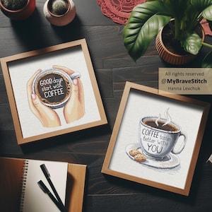 May include: Two square framed cross-stitch artworks. One shows hands holding a coffee mug with the text GOOD days start with COFFEE. The other shows a steaming coffee mug on a saucer with two cookies and the text COFFEE tastes better WITH YOU.