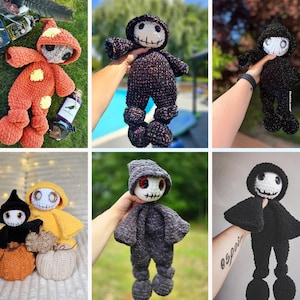 May include: A collection of handmade crochet dolls in various colors, including orange, black, yellow, and gray. Each doll features a skull-like face with stitched details and is wearing a hooded outfit. The dolls have elongated legs and arms.