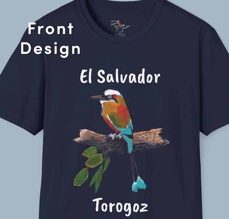May include: A navy blue t-shirt with a white graphic of a colorful bird perched on a branch. The bird has a long, blue tail and is surrounded by green leaves. The text "El Salvador" and "Torogoz" are printed in white below the bird.