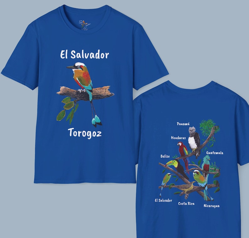 May include: Two royal blue t-shirts with a bird and text on the front and a bird design on the back. The front of the left shirt features a colorful bird with the text "El Salvador Torogoz". The back of the right shirt features a design of birds with the names of Central American countries: Panama, Honduras, Belize, Guatemala, El Salvador, Costa Rica, and Nicaragua.