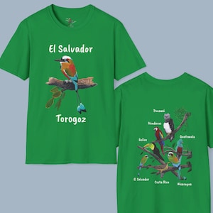 May include: Green t-shirt with a bird illustration and the text "El Salvador Torogoz". The back of the shirt features a map of Central America with birds representing each country.