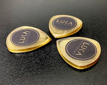 Handmade guitar pick made of yellow amber ultem material in shape of flow best gift for guitarist by Luka Plectrums - Amber Flow