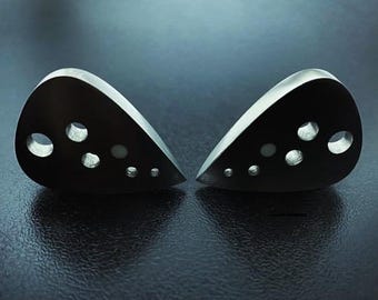 Unique beautiful handcrafted titanium guitar plectrum in shape of teardrop with holes and glowing dot design art by Luka - Hollow Tear