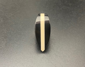 Triple layer handcrafted guitar pick made of black and natural high quality peek plastic in shape of teardrop design art by Luka Plectrums