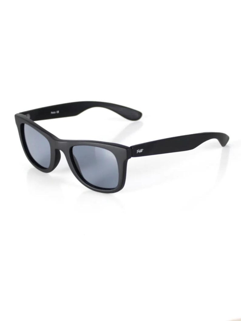 May include: Black sunglasses with a matte finish and a subtle logo on the side.
