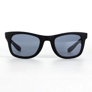 May include: Black sunglasses with a square frame and dark gray lenses.
