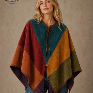 May include: A colorful patchwork poncho with a geometric design. The poncho features panels of red, orange, teal, green, and purple. It has a brown leather trim and a tie closure with decorative beads. The brand logo "STITCHGB LEATHER" is visible.