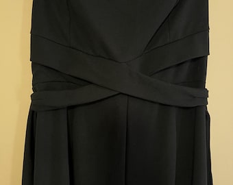 Preowned, “Blashe” Large Strapless Black Women’s Jumpsuit with a wide-leg cut and a criss-cross detail at the waist, polyester/Spandex