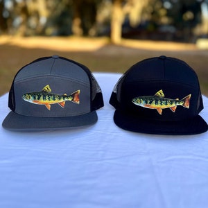 May include: Two trucker hats with a fish design. One hat is gray with black mesh and the other is black with black mesh.