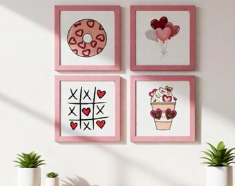 Könnte beinhalten: Vier gerahmte Kunstdrucke mit rosa Rahmen. Die Drucke zeigen einen Donut mit Herzformen, herzförmige Ballons, ein Tic-Tac-Toe-Spiel mit Herzen und eine Kaffeetasse mit herzförmigen Sonnenbrillen. Die Kunst wird über einer Holzoberfläche ausgestellt.