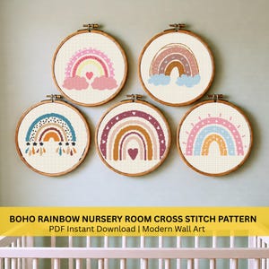 May include: Five cross-stitch rainbow patterns in wooden hoops. Each rainbow features a unique color palette, including pink, blue, and brown, with hearts and clouds. The text at the bottom reads "BOHO RAINBOW NURSERY ROOM CROSS STITCH PATTERN PDF Instant Download | Modern Wall Art."