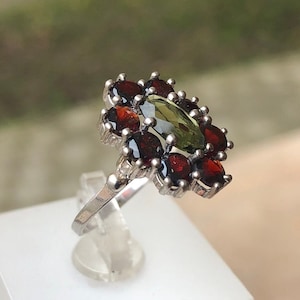 Genuine Moldavite Ring in 925 Sterling Silver with Red Garnet around. Moldavite Jewellery / Meteorite / Vltavin / Tektite.