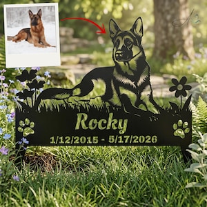 May include: A black metal memorial garden stake featuring a cutout silhouette of a German Shepherd dog lying down, flanked by flowers and paw prints. The name Rocky and the dates 1/12/2015 - 5/17/2026 are cut into the metal base.