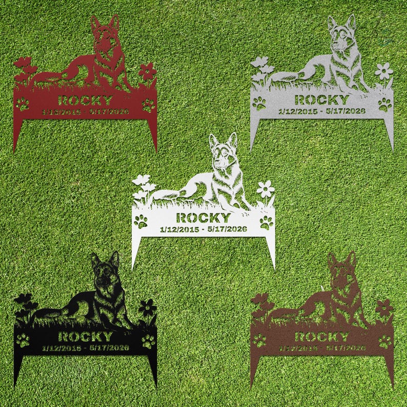 May include: Five metal garden stakes featuring a German Shepherd dog silhouette lying in grass with flowers. Each stake displays the name ROCKY and the dates 1/12/2015 - 5/17/2026, with paw prints on the sides. Available in red, silver, white, black, and brown.