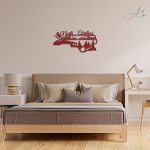 North Carolina state outline metal sign displayed in a modern home bedroom.
