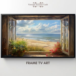 Puede incluir: Una pintura enmarcada de una ventana con vista a una playa y al océano. La ventana está abierta y hay flores en macetas en el alféizar de la ventana. El cielo es azul con nubes blancas. La pintura está en un marco negro.