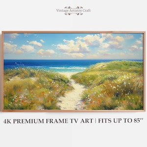 Puede incluir: Pintura enmarcada de un paisaje de playa. La obra representa un camino arenoso que conduce al océano bajo un cielo azul con nubes esponjosas. El primer plano presenta hierbas verdes y amarillas y flores silvestres. El texto en la parte inferior dice "4K PREMIUM FRAME TV ART | FITS UP TO 85".