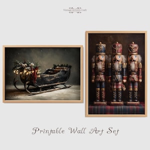 May include: Printable wall art set featuring two framed images. One depicts a vintage sleigh with festive greenery and lights. The other showcases three decorative nutcrackers in uniform, standing on a plaid surface. The frames are light wood.
