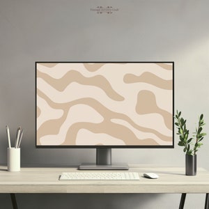 May include: A computer monitor with a beige and white abstract wavy pattern as the desktop background. The monitor is on a light wood desk with a white keyboard, a white mouse, a white pencil holder with pencils, and a small potted plant.