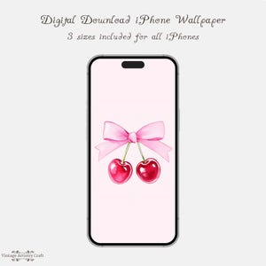 Könnte beinhalten: Eine rosa und weiße iPhone-Tapete mit einer rosa Schleife und zwei roten Kirschen. Der Hintergrund ist hellrosa.
