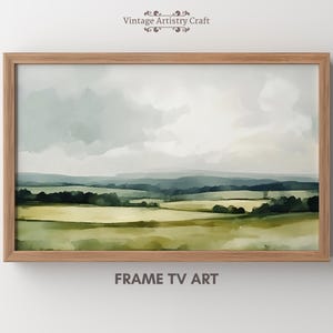 Peut inclure: Une peinture à l'aquarelle encadrée d'un paysage avec des collines verdoyantes et un ciel nuageux. La peinture est dans un cadre en bois clair.
