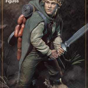 May include: A detailed figurine of a curly-haired character wearing a green textured cloak, a light-colored shirt, and dark trousers. The figure carries a rolled sleeping mat and a sword, with the text "nom nom Figures" visible in the upper corner.