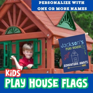 May include: A blue and white personalised playhouse flag with the text "Jackson's Play House" and "Adventure Awaits". The flag is hanging on a wooden playhouse.