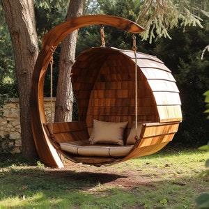 Handcrafted wooden garden swing chairs undergo finishing processes to protect