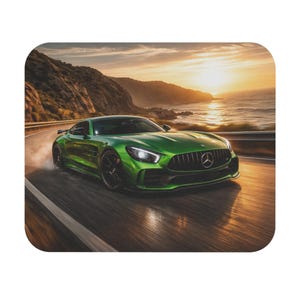 May include: A vibrant green sports car speeds along a coastal road at sunset. The car has black rims and a prominent front grille. The background features a scenic view of the ocean and mountains under a golden sky.
