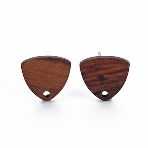 May include: A pair of wooden guitar pick earrings. The earrings are brown and have a natural wood grain pattern. They are shaped like a guitar pick and have a small hole in the centre.