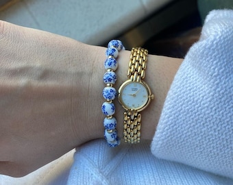 Elegant blue flower ceramic bead bracelet with a stretchable size string
