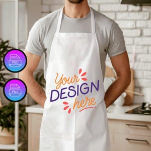 May include: A white apron with the text "Your Design Here" in purple and orange lettering. The apron is being worn by a person in a kitchen setting.