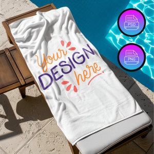 May include: White beach towel with the text "Your Design Here" in purple, orange, and pink lettering. The towel is lying on a wooden deck chair by a pool.