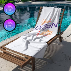 May include: White beach towel with the text "Your Design Here" in colorful lettering, lying on a wooden lounge chair by a swimming pool.
