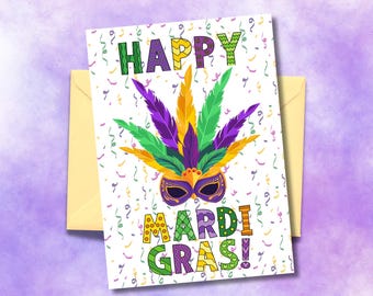 May include: A white card with a colorful Mardi Gras mask and the text "Happy Mardi Gras!" in colorful letters. The background is white with confetti.