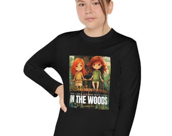 May include: Black long-sleeve shirt with a colorful illustration of two girls on a bridge. The text "Two little sisters who lived in the woods" is printed on the shirt.