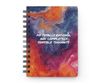 May include: Spiral-bound notebook with a colorful abstract design in shades of orange, blue, and purple. The cover features the text "MY TOTALLY RATIONAL AND COMPLETELY SENSIBLE THOUGHTS" in white. The notebook has a black spiral binding.