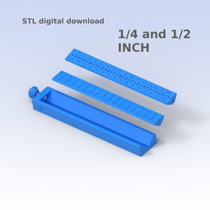May include: A 3D printed ruler for measuring in 1/4 and 1/2 inch increments. The ruler is blue and has markings for each 1/4 inch. The ruler is designed to be printed in three pieces.
