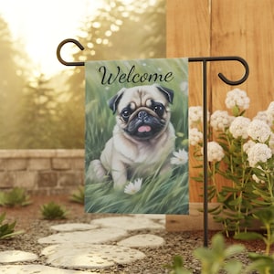 May include: A welcome garden flag with a cute pug dog sitting in a field of green grass and white flowers. The flag has the word "Welcome" printed on it.