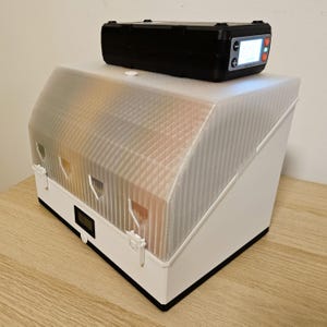 Drybox connected to a PolyDryer unit for active filament drying during printing.
