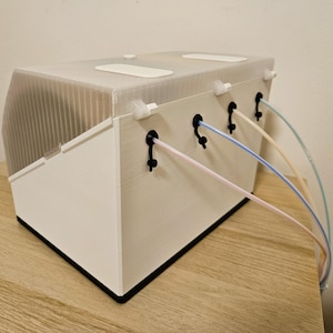 Rear view of the drybox with multi‑spool filament feed ports.