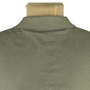 May include: Close-up of the back of a sage green corduroy jacket. The collar is visible, along with the textured fabric and vertical lines of the corduroy. The jacket is displayed on a mannequin.