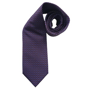 May include: A rolled-up, patterned necktie. The tie is a deep burgundy color with a repeating pattern of small blue squares. The tie is made of a smooth fabric and is suitable for formal or business attire.