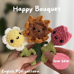 May include: Three crocheted plush flowers with smiling faces and black bead eyes. The flowers are yellow, brown, and pink with green stems. Text on the image reads Happy Bouquet and low sew. The bottom text reads English PDF pattern.