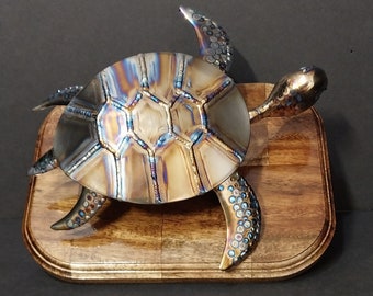 Metal art Sea Turtle. Titanium Turtle, Acacia base. Pure 6AL-4V Titanium plate / ERTi-5 welding rod. Original one of a kind art piece.