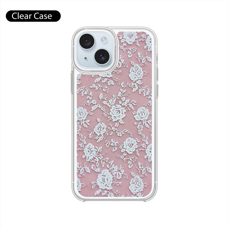 May include: Clear phone case with a white lace pattern on a pink background. The case has a cutout for the camera lens.