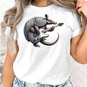 Gürteltier, das Gitarre spielt Grafik-T-Shirt, einzigartiges Musiker-Geschenk, Tierliebhaber-T-Stück, Unisex Hemd
